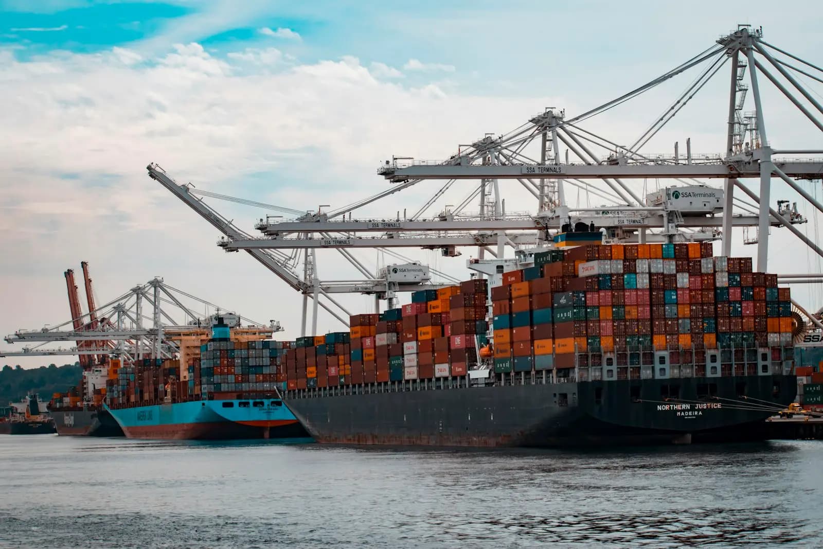 Port cranes unloading a container vessel